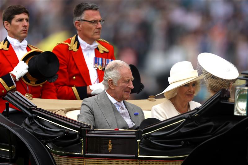 ASCOT, ENGLAND - JUNE 20: King Charles III arrives with Queen Camilla in The Royal Procession prior to Royal Ascot 2023 at Ascot Racecourse on June 20, 2023 in Ascot, England. (Photo by Alex Pantling/Getty Images)