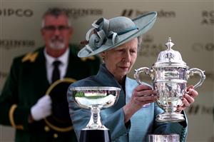 ASCOT, ENGLAND - JUNE 20: Anne, Princess Royal lifts the winners trophy for the St James's Palace Stakes Royal Ascot 2023 at Ascot Racecourse on June 20, 2023 in Ascot, England. (Photo by Alex Pantling/Getty Images)