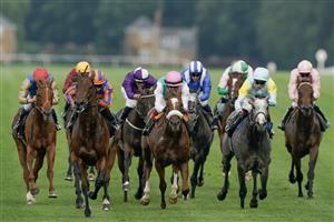 ASCOT, ENGLAND - JUNE 20: Ryan Moore riding Paddington (L, orange/blue) win The St James's Palace Stakes on day one during Royal Ascot 2023 at Ascot Racecourse on June 20, 2023 in Ascot, England. (Photo by Alan Crowhurst/Getty Images for Ascot Racecourse)