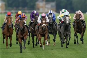 ASCOT, ENGLAND - JUNE 20: Ryan Moore riding Paddington (L, orange/blue) win The St James's Palace Stakes on day one during Royal Ascot 2023 at Ascot Racecourse on June 20, 2023 in Ascot, England. (Photo by Alan Crowhurst/Getty Images for Ascot Racecourse)
