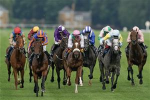 ASCOT, ENGLAND - JUNE 20: Ryan Moore riding Paddington (L, orange/blue) win The St James's Palace Stakes on day one during Royal Ascot 2023 at Ascot Racecourse on June 20, 2023 in Ascot, England. (Photo by Alan Crowhurst/Getty Images for Ascot Racecourse)