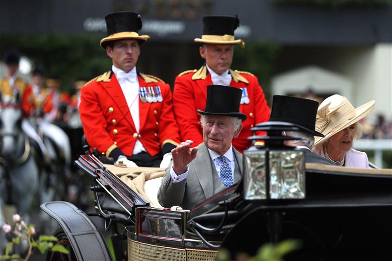 ASCOT, ENGLAND - JUNE 21: King Charles III arrives with Queen Camilla in The Royal Procession during day two of Royal Ascot 2023 at Ascot Racecourse on June 21, 2023 in Ascot, England. (Photo by Alex Pantling/Getty Images)