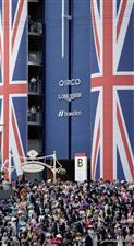 ASCOT, ENGLAND - JUNE 21: Racegoers wait for the royal procession to arrive on day two during Royal Ascot 2023 at Ascot Racecourse on June 21, 2023 in Ascot, England. (Photo by Alan Crowhurst/Getty Images for Ascot Racecourse)