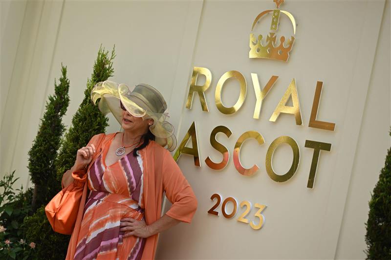 A racegoer poses for a photo on Ladies Day, the third day of the Royal Ascot horse racing meeting in Ascot, west of London, on June 22, 2023. (Photo by JUSTIN TALLIS / AFP) (Photo by JUSTIN TALLIS/AFP via Getty Images)