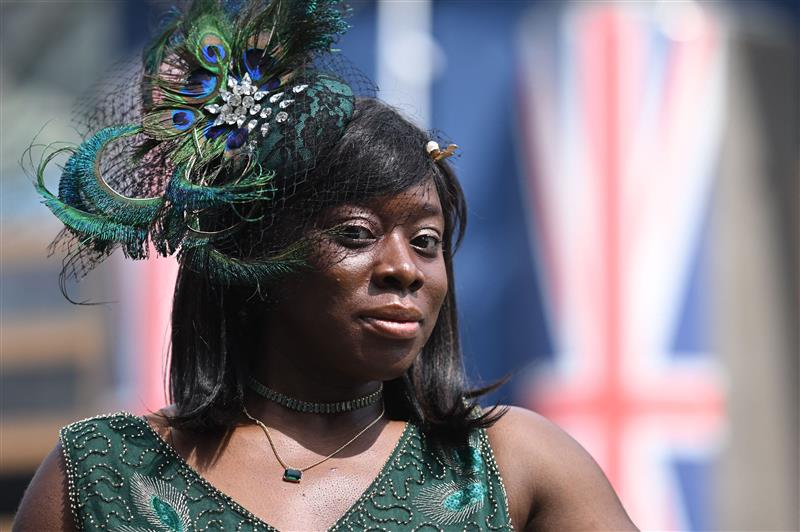 A racegoer poses for a photo in the summer sunshine on Ladies Day, the third day of the Royal Ascot horse racing meeting in Ascot, west of London, on June 22, 2023. (Photo by JUSTIN TALLIS / AFP) (Photo by JUSTIN TALLIS/AFP via Getty Images)