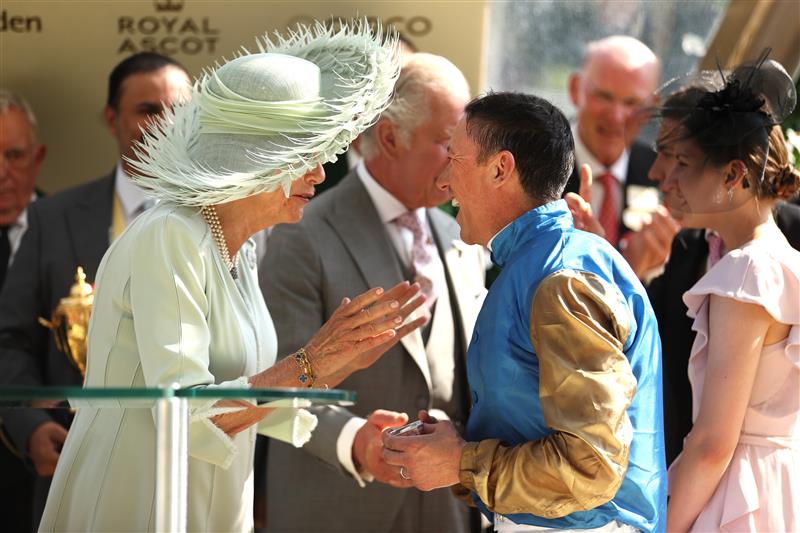 ASCOT, ENGLAND - JUNE 22: Frankie Dettori riding Courage Mon Ami reacts after he kisses Queen Camilla on the cheek as he celebrates winning The Gold Cup during day three of Royal Ascot 2023 at Ascot Racecourse on June 22, 2023 in Ascot, England. (Photo by Alex Pantling/Getty Images)