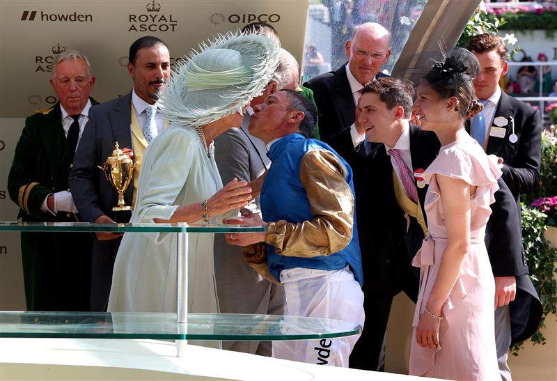 ASCOT, ENGLAND - JUNE 22: Queen Camilla congratulates Frankie Dettori after riding Courage Mon Ami to winning The Gold Cup on day three during Royal Ascot 2023 at Ascot Racecourse on June 22, 2023 in Ascot, England. (Photo by Tom Dulat/Getty Images for Ascot Racecourse)
