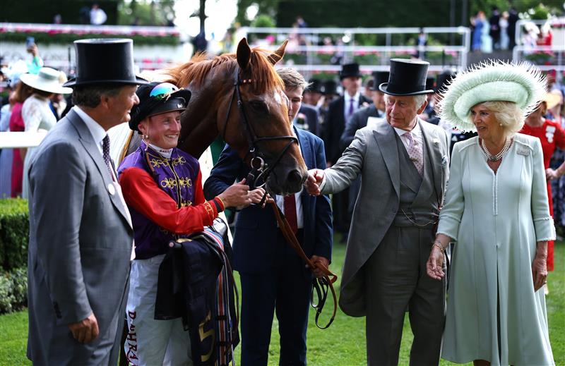 ASCOT, ENGLAND - JUNE 22: Desert Hero ridden by Tom Marquand with owners HM the King and HM The Queen after The King George V Stakes during day three of Royal Ascot 2023 at Ascot Racecourse on June 22, 2023 in Ascot, England. (Photo by Alex Pantling/Getty Images)