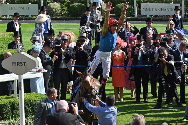 Jockey Frankie Dettori (red cap) performs his flying dismount from Courage Mon Ami after victory in the Ascot Gold Cup on the third day of the Royal Ascot horse racing meeting in Ascot, west of London, on June 22, 2023. (Photo by JUSTIN TALLIS / AFP) (Photo by JUSTIN TALLIS/AFP via Getty Images)