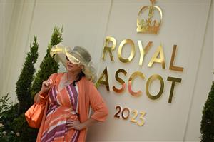 A racegoer poses for a photo on Ladies Day, the third day of the Royal Ascot horse racing meeting in Ascot, west of London, on June 22, 2023. (Photo by JUSTIN TALLIS / AFP) (Photo by JUSTIN TALLIS/AFP via Getty Images)