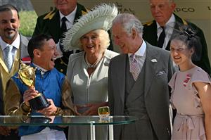 Jockey Frankie Dettori (2L) shares a joke with Britain