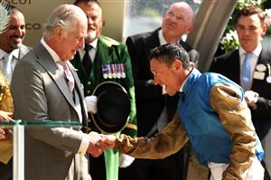 ASCOT, ENGLAND - JUNE 22: Frankie Dettori riding Courage Mon Ami shakes hands with King Charles III as he celebrates winning The Gold Cup during day three of Royal Ascot 2023 at Ascot Racecourse on June 22, 2023 in Ascot, England. (Photo by Alex Pantling/Getty Images)