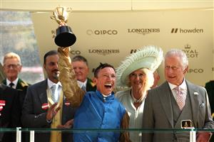 ASCOT, ENGLAND - JUNE 22: Frankie Dettori riding Courage Mon Ami lifts the Gold cup next to King Charles III and Queen Camilla during day three of Royal Ascot 2023 at Ascot Racecourse on June 22, 2023 in Ascot, England. (Photo by Alex Pantling/Getty Images)
