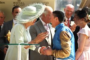 ASCOT, ENGLAND - JUNE 22: Frankie Dettori riding Courage Mon Ami reacts after he kisses Queen Camilla on the cheek as he celebrates winning The Gold Cup during day three of Royal Ascot 2023 at Ascot Racecourse on June 22, 2023 in Ascot, England. (Photo by Alex Pantling/Getty Images)