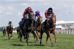 ASCOT, ENGLAND - JUNE 22: Tom Marquand riding Desert Hero (red sleeves, black cap) win The King George V Stakes on day three during Royal Ascot 2023 at Ascot Racecourse on June 22, 2023 in Ascot, England. (Photo by Alan Crowhurst/Getty Images for Ascot Racecourse)
