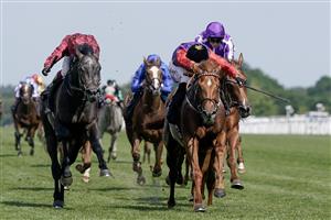 ASCOT, ENGLAND - JUNE 22: Tom Marquand riding Desert Hero (red sleeves, black cap) win The King George V Stakes on day three during Royal Ascot 2023 at Ascot Racecourse on June 22, 2023 in Ascot, England. (Photo by Alan Crowhurst/Getty Images for Ascot Racecourse)
