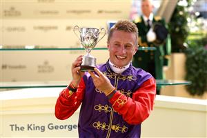 ASCOT, ENGLAND - JUNE 22:  Tom Marquand riding Desert Hero poses with the trophy after winning The King George V Stakes  during day three of Royal Ascot 2023 at Ascot Racecourse on June 22, 2023 in Ascot, England. (Photo by Alex Pantling/Getty Images)