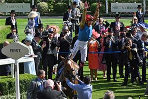 Jockey Frankie Dettori (red cap) performs his flying dismount from Courage Mon Ami after victory in the Ascot Gold Cup on the third day of the Royal Ascot horse racing meeting in Ascot, west of London, on June 22, 2023. (Photo by JUSTIN TALLIS / AFP) (Photo by JUSTIN TALLIS/AFP via Getty Images)