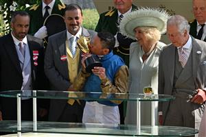 Jockey Frankie Dettori kisses the Gold Cup trophy at the presentation after his victory on Courage Mon Ami in the Ascot Gold Cup on the third day of the Royal Ascot horse racing meeting in Ascot, west of London, on June 22, 2023. (Photo by JUSTIN TALLIS / AFP) (Photo by JUSTIN TALLIS/AFP via Getty Images)