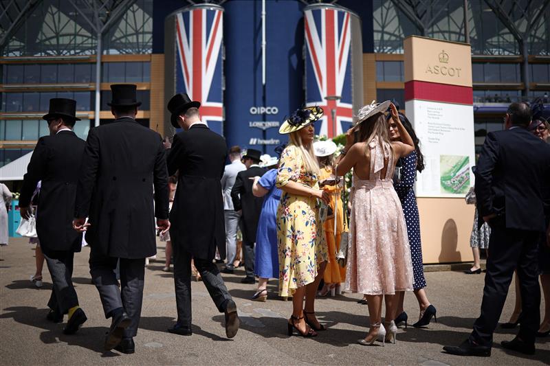 Racegoers mingle ahead of racing on the fourth day of the Royal Ascot horse racing meeting in Ascot, west of London, on June 23, 2023. (Photo by HENRY NICHOLLS / AFP) (Photo by HENRY NICHOLLS/AFP via Getty Images)