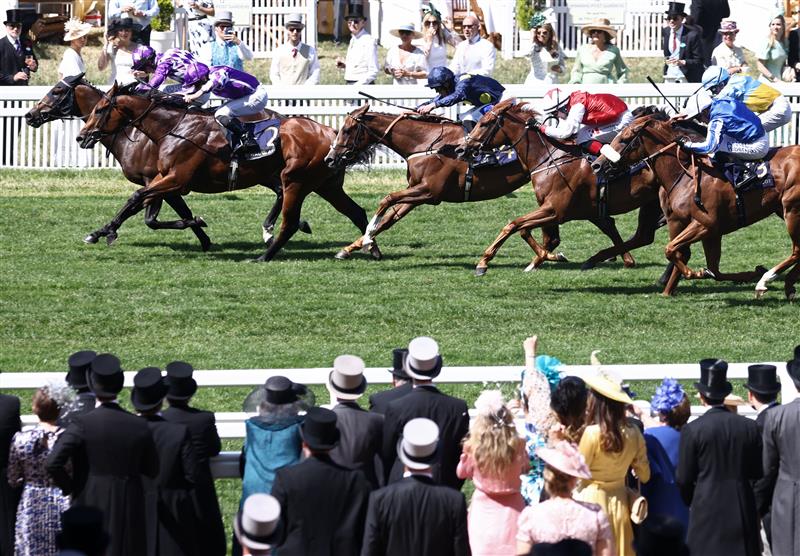 Jockey Oisin Murphy rides Shaquille (L) to victory over Ryan Moore on Little Big Bear (2L) in the Commonwealth Cup on the fourth day of the Royal Ascot horse racing meeting in Ascot, west of London, on June 23, 2023. (Photo by HENRY NICHOLLS / AFP) (Photo by HENRY NICHOLLS/AFP via Getty Images)