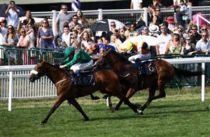 Jockey Chrids Hayes riding Tahiyra (L) compete to win ahead of third-placed Sounds of Heaven ridden by jockey Ronan Whelan (R), in the Coronation Stakes race on the fourth day of the Royal Ascot horse racing meeting in Ascot, west of London, on June 23, 2023. (Photo by HENRY NICHOLLS / AFP) (Photo by HENRY NICHOLLS/AFP via Getty Images)
