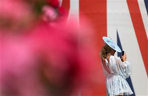ASCOT, ENGLAND - JUNE 23: A racegoer takes a photograph on her phone during day four of Royal Ascot 2023 at Ascot Racecourse on June 23, 2023 in Ascot, England. (Photo by Alex Pantling/Getty Images)