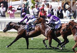 Jockey Oisin Murphy rides Shaquille (L) to victory over Ryan Moore on Little Big Bear (R) in the Commonwealth Cup on the fourth day of the Royal Ascot horse racing meeting in Ascot, west of London, on June 23, 2023. (Photo by HENRY NICHOLLS / AFP) (Photo by HENRY NICHOLLS/AFP via Getty Images)