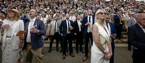 CHICHESTER, ENGLAND - AUGUST 04: Racegoers watch the racing at Goodwood Racecourse on August 04, 2023 in Chichester, England. (Photo by Alan Crowhurst/Getty Images)