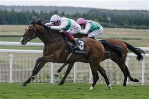 CHICHESTER, ENGLAND - AUGUST 04: Frankie Dettori riding Epictetus (white) win The Bonhams Thoroughbred Stakes from Ryan Moore and Nostrum at Goodwood Racecourse on August 04, 2023 in Chichester, England. (Photo by Alan Crowhurst/Getty Images)