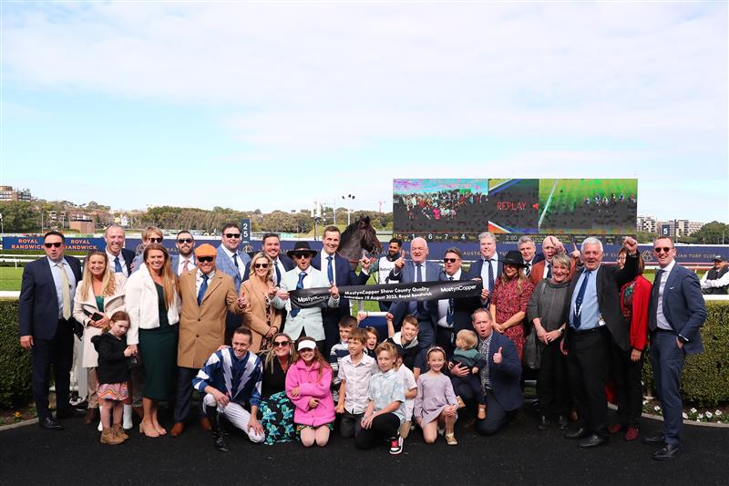 SYDNEY, AUSTRALIA - AUGUST 19:  Trainer Matthew Smith celebrates with owners and VIPs after Dylan Gibbons riding Buenos Noches wins Race 5 Mostyncopper Show County Quality during "Winx Stakes Day" - Sydney Racing at Royal Randwick Racecourse on August 19, 2023 in Sydney, Australia. (Photo by Jeremy Ng/Getty Images)
