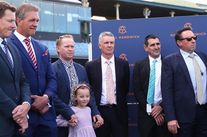 SYDNEY, AUSTRALIA - AUGUST 19:  Trainer Matthew Smith celebrates with owners and VIPs after Dylan Gibbons riding Buenos Noches wins Race 5 Mostyncopper Show County Quality during "Winx Stakes Day" - Sydney Racing at Royal Randwick Racecourse on August 19, 2023 in Sydney, Australia. (Photo by Jeremy Ng/Getty Images)