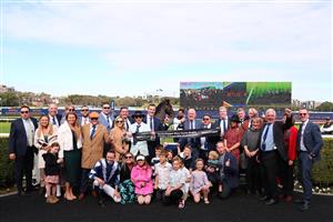 SYDNEY, AUSTRALIA - AUGUST 19:  Trainer Matthew Smith celebrates with owners and VIPs after Dylan Gibbons riding Buenos Noches wins Race 5 Mostyncopper Show County Quality during "Winx Stakes Day" - Sydney Racing at Royal Randwick Racecourse on August 19, 2023 in Sydney, Australia. (Photo by Jeremy Ng/Getty Images)