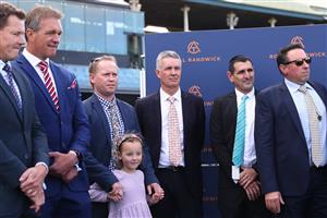 SYDNEY, AUSTRALIA - AUGUST 19:  Trainer Matthew Smith celebrates with owners and VIPs after Dylan Gibbons riding Buenos Noches wins Race 5 Mostyncopper Show County Quality during "Winx Stakes Day" - Sydney Racing at Royal Randwick Racecourse on August 19, 2023 in Sydney, Australia. (Photo by Jeremy Ng/Getty Images)