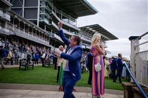 YORK, ENGLAND - AUGUST 23: A racegoer celebrates a winner at York Racecourse on August 23, 2023 in York, England. (Photo by Alan Crowhurst/Getty Images)