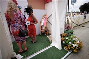 YORK, ENGLAND - AUGUST 23: A best dressed show for racegoers to enter at York Racecourse on August 23, 2023 in York, England. (Photo by Alan Crowhurst/Getty Images)