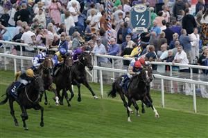 YORK, ENGLAND - AUGUST 23: Daniel Tudhope riding Indian Run (L, gold sleeves) win The Tattersalls Acomb Stakes at York Racecourse on August 23, 2023 in York, England. (Photo by Alan Crowhurst/Getty Images)