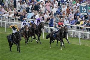 YORK, ENGLAND - AUGUST 23: Daniel Tudhope riding Indian Run (L, gold sleeves) win The Tattersalls Acomb Stakes at York Racecourse on August 23, 2023 in York, England. (Photo by Alan Crowhurst/Getty Images)