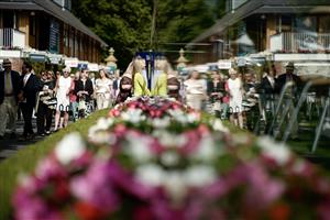 YORK, ENGLAND - AUGUST 23: A reflection of racegoers as they arrive at York Racecourse on August 23, 2023 in York, England. (Photo by Alan Crowhurst/Getty Images)