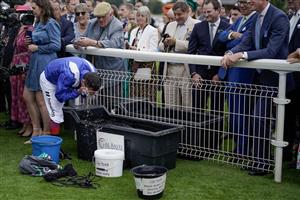 YORK, ENGLAND - AUGUST 23: Frankie Dettori freshens himself up in the winners enclosure after riding Mostahdaf to win The Juddmonte International Stakes at York Racecourse on August 23, 2023 in York, England. (Photo by Alan Crowhurst/Getty Images)