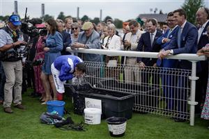 YORK, ENGLAND - AUGUST 23: Frankie Dettori freshens himself up in the winners enclosure after riding Mostahdaf to win The Juddmonte International Stakes at York Racecourse on August 23, 2023 in York, England. (Photo by Alan Crowhurst/Getty Images)