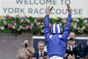 YORK, ENGLAND - AUGUST 23: Frankie Dettori leaps from his mount after riding Mostahdaf to win The Juddmonte International Stakes at York Racecourse on August 23, 2023 in York, England. (Photo by Alan Crowhurst/Getty Images)