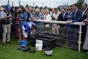 YORK, ENGLAND - AUGUST 23: Frankie Dettori freshens himself up in the winners enclosure after riding Mostahdaf to win The Juddmonte International Stakes at York Racecourse on August 23, 2023 in York, England. (Photo by Alan Crowhurst/Getty Images)