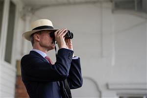 YORK, ENGLAND - AUGUST 23: Watching the action through binoculars at York Racecourse on August 23, 2023 in York, England. (Photo by Alan Crowhurst/Getty Images)