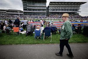 YORK, ENGLAND - AUGUST 23: Racegoers relax in the