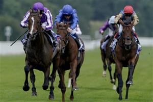 YORK, ENGLAND - AUGUST 23: Ryan Moore riding Continuous (L, purple) win The Sky Bet Great Voltigeur Stakesat York Racecourse on August 23, 2023 in York, England. (Photo by Alan Crowhurst/Getty Images)