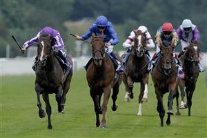YORK, ENGLAND - AUGUST 23: Ryan Moore riding Continuous (L, purple) win The Sky Bet Great Voltigeur Stakes at York Racecourse on August 23, 2023 in York, England. (Photo by Alan Crowhurst/Getty Images)