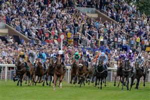 YORK, ENGLAND - AUGUST 24: Racegoers look on as runners ease down after finishing The Goffs UK Harry Beeby Premier Yearling Stakes at York Racecourse on August 24, 2023 in York, England. (Photo by Alan Crowhurst/Getty Images)