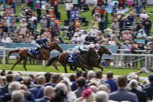 YORK, ENGLAND - AUGUST 24: James Doyle riding Warm Heart (R, pink) win The Pertemps Network Yorkshire Oaks from Frankie Dettori and Free Wind (white/green) at York Racecourse on August 24, 2023 in York, England. (Photo by Alan Crowhurst/Getty Images)