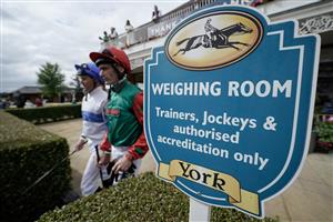 YORK, ENGLAND - AUGUST 24: Jockeys leave the weighing room at York Racecourse on August 24, 2023 in York, England. (Photo by Alan Crowhurst/Getty Images)